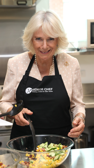 Camilla, Duchess of Cornwall takes part in a cooking class with the "The Cooks" senior chefs as she attends an Active Elderly engagement at the Salvation Army Centre on November 22, 2019 in Christchurch, New Zealand