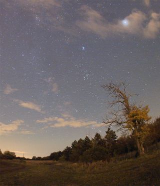 The faint streak of an Orionid meteor is visible in the top center of this photo snapped by amateur astronomer Monika Landy-Gyebnar from her favorite skywatching spot east of her home in Veszprem, Hungary, on Oct. 22, 2011 during the peak of the annual Or