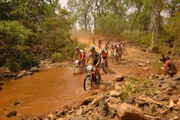 Women's race leader Monique Zeldenrust leaders a group across a creek crossing