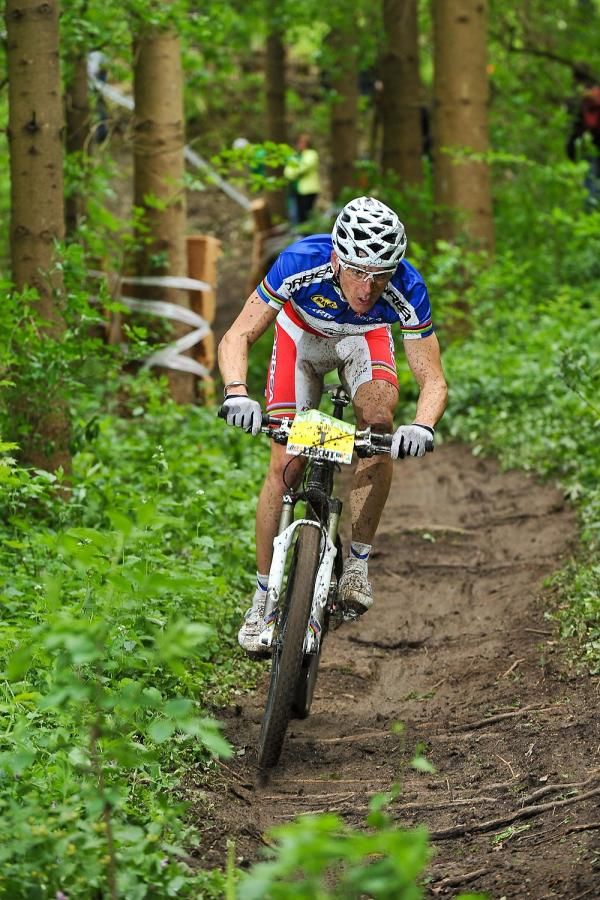 Julien Absalon (Orbea) races through the trees en route to victory.