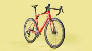 A red Wilier Granturismo SLR carbon road bike on a yellow background