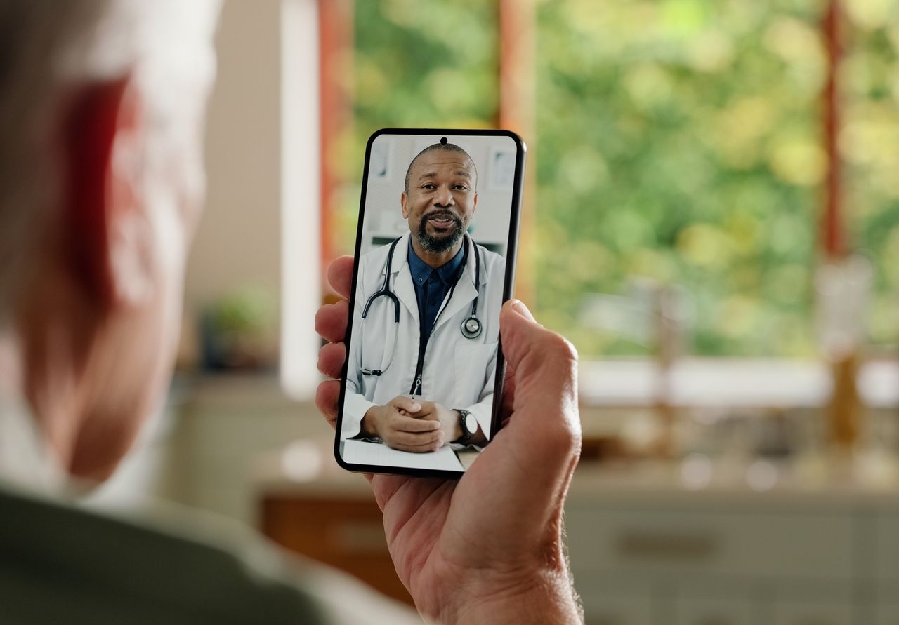 Man, cellphone screen and telehealth with doctor or online consultation at home or virtual advice, discussion or diagnosis. Patient, healthcare worker and internet conversation, service or futuristic