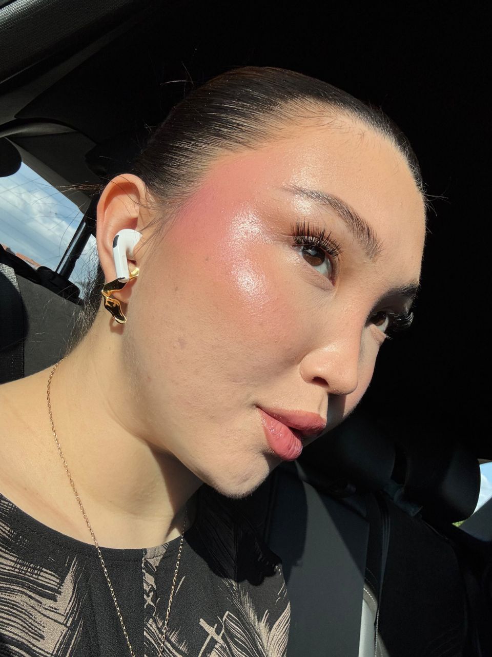 An image showing Denise Primbet testing various blush products