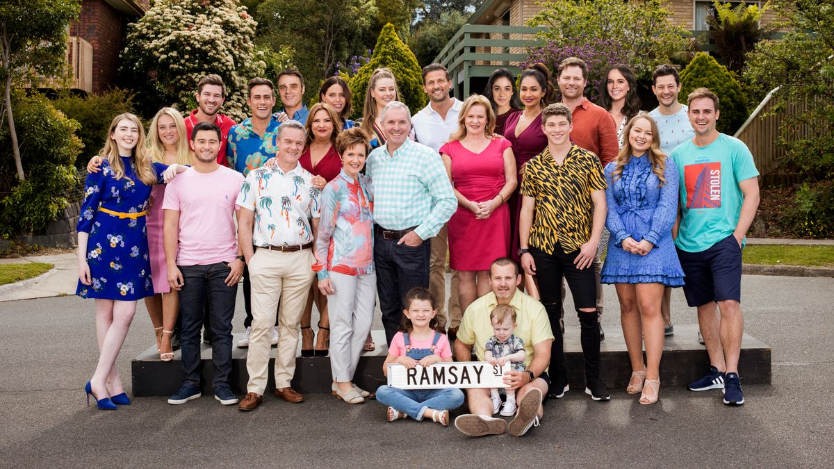 Neighbours cast standing on Ramsay Street in 2020