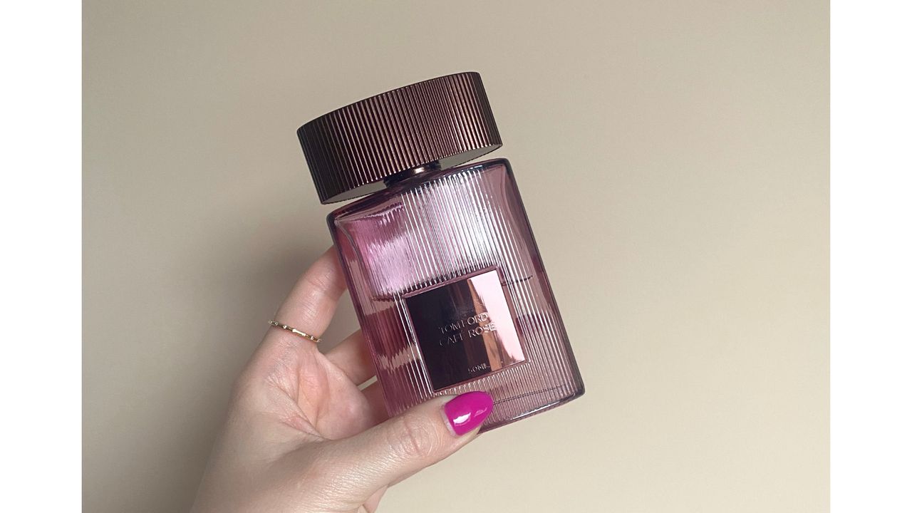 Close of up hand holding Tom Ford Caf&eacute; Rose Eau de Parfum