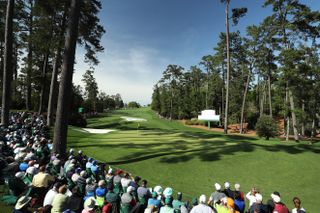 Patrons watch play on the tenth green during the first round of the 2018 Masters Tournament at Augusta National Golf Club. Photo by David Cannon/Getty Images.