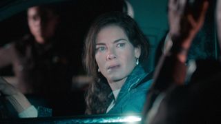 Michelle Monaghan as Leni McCleary, staring concerned out of a car, in of Echoes