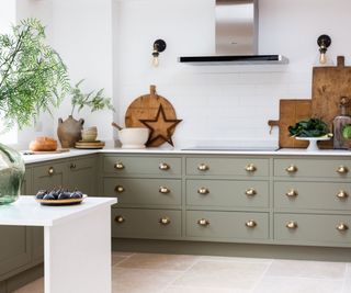 sage Shaker kitchen with brass cup handles