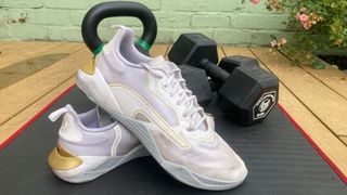 Puma Fuse 2.0 posed with dumbbells in background