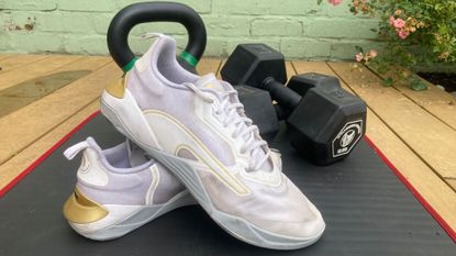 Puma Fuse 2.0 posed with dumbbells in background