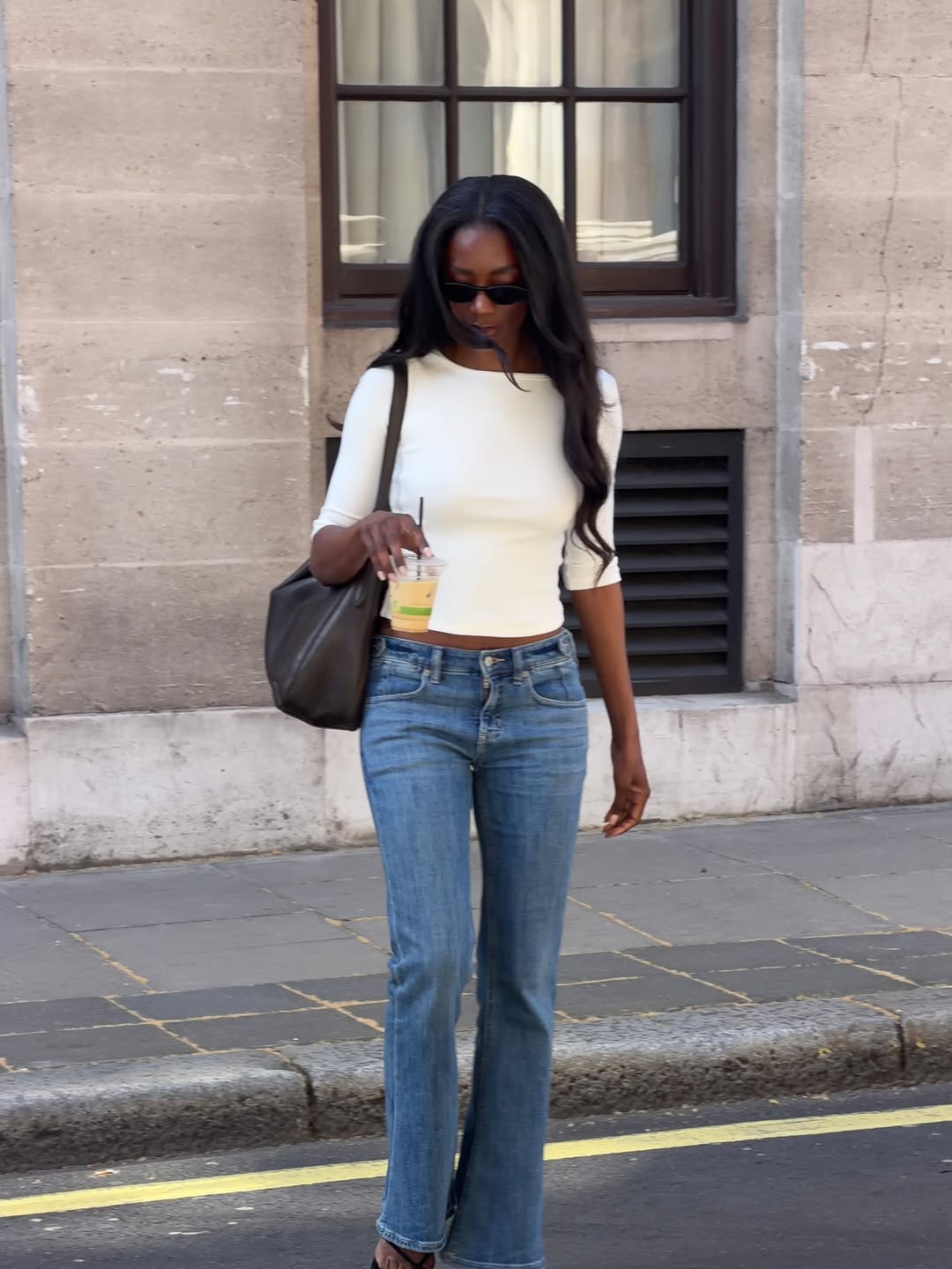 An image of woman wearing elbow-length tee, one of the biggest early summer 2026 micro trends.