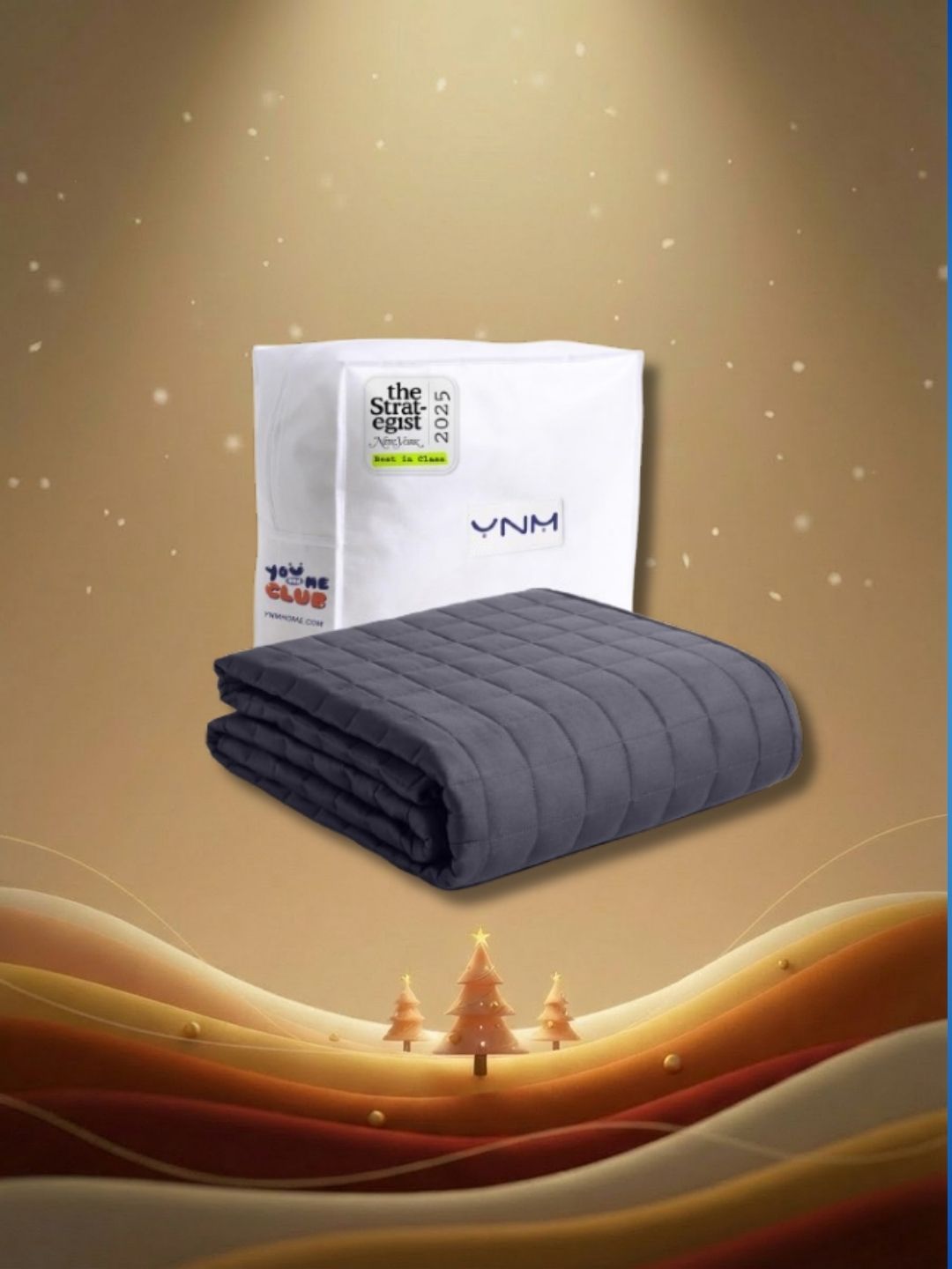 Grey weighted blanket on brown graphic background with gradient waves at bottom, three mini Christmas tress and stars