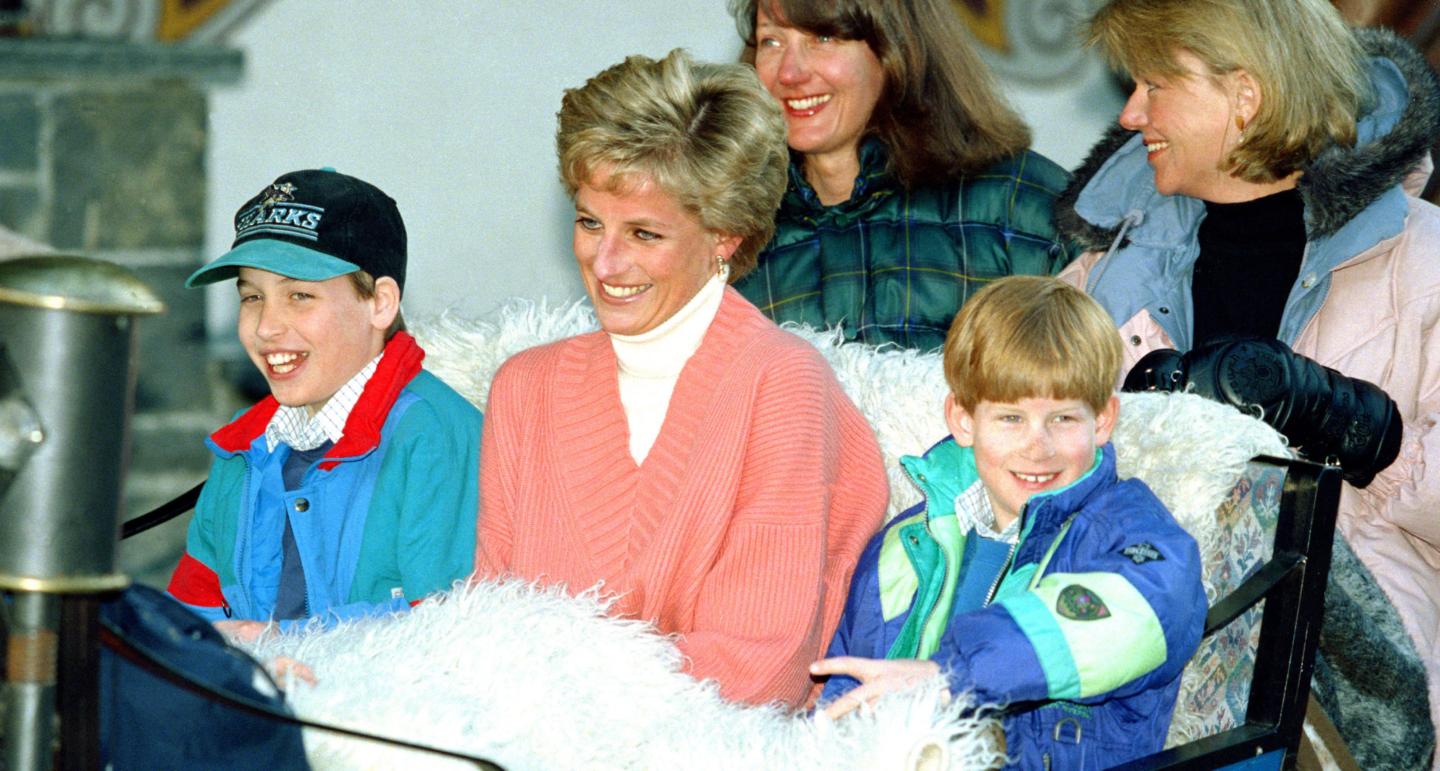 Princess Diana riding in a sleigh with Prince Harry and Prince William