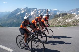 Three cyclists on a mountain pass