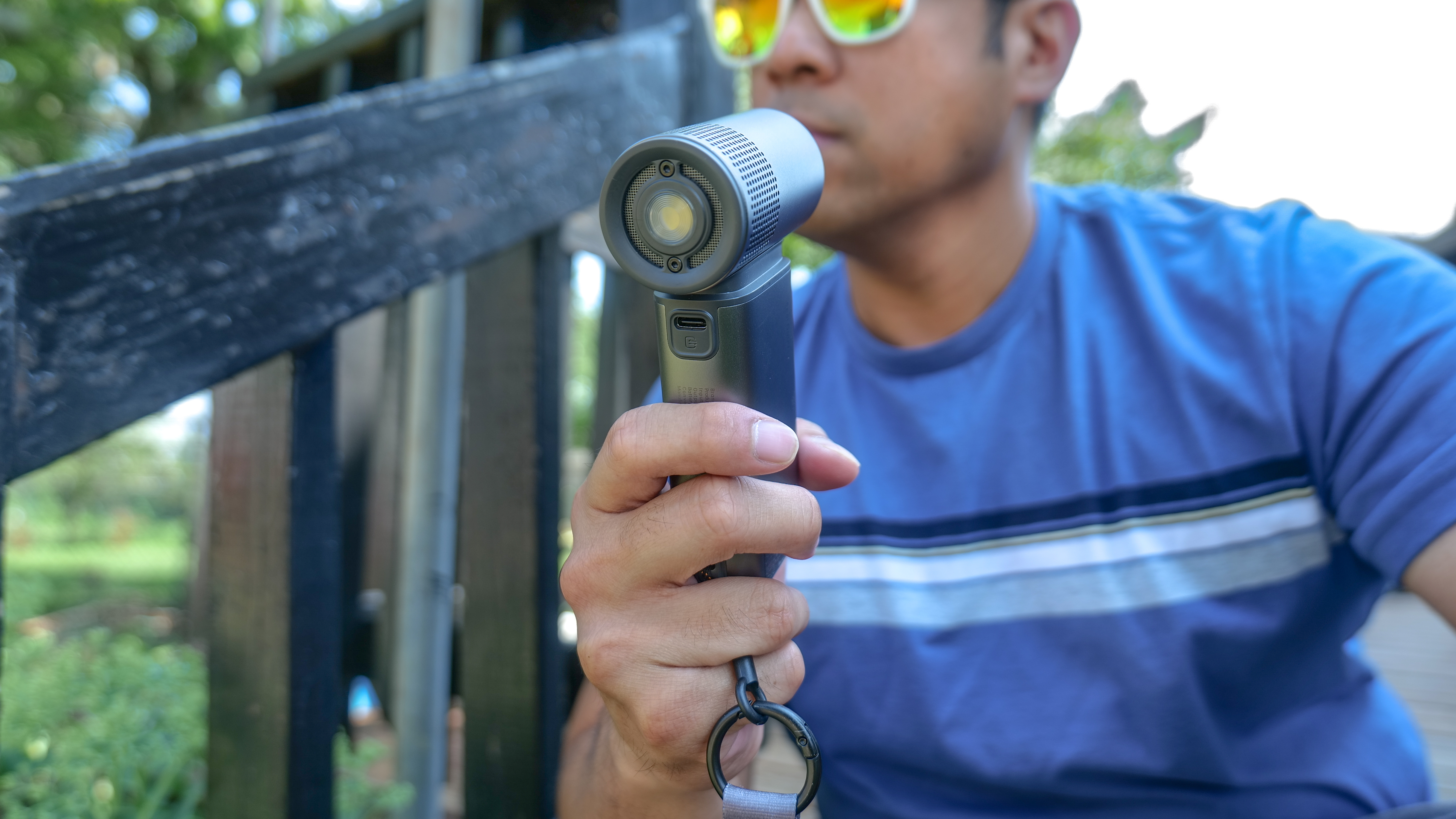 JisuLife Handheld Fan Ultra2 being used to beat the heatwave.
