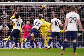 Sergi Canos, centre, scores an own goal to put Tottenham ahead