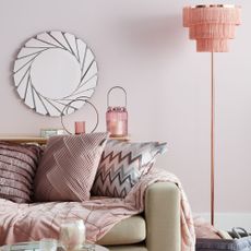 pink living room with sofa and lamp light