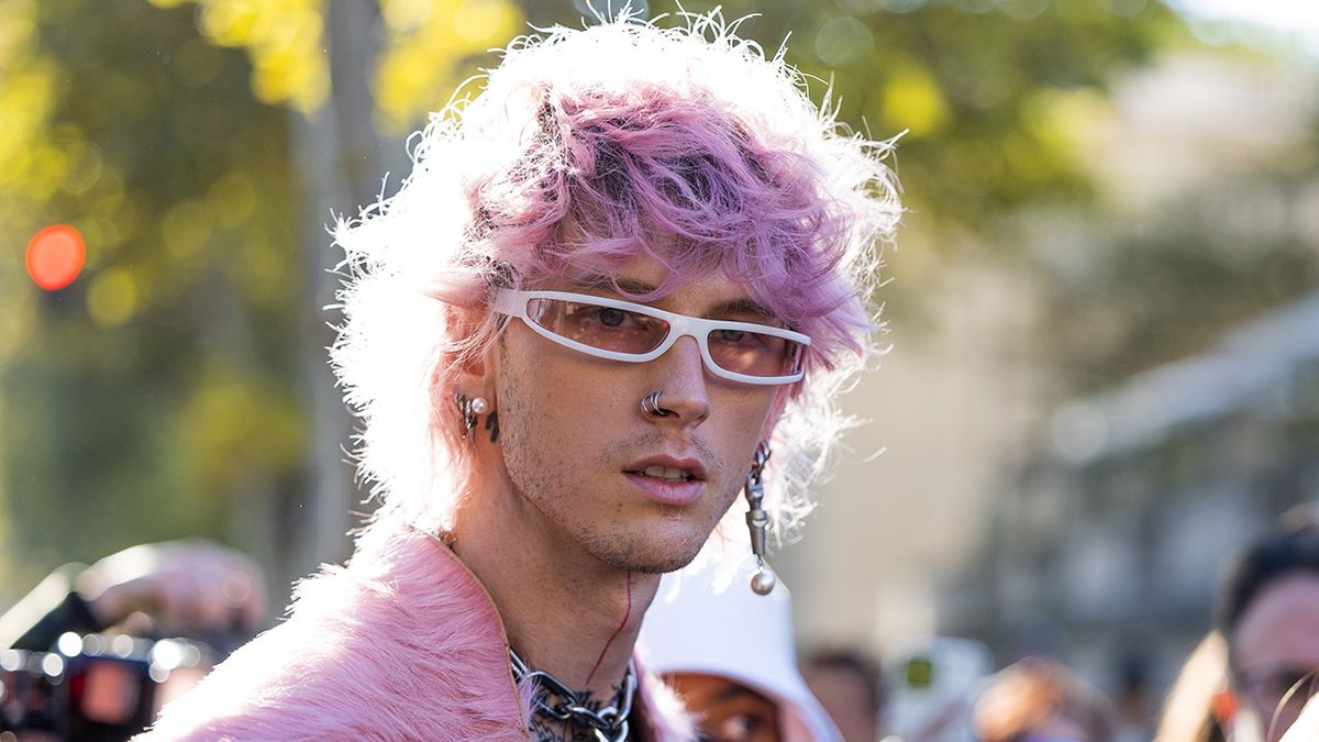 Machine Gun Kelly pulls off messy platinum locks and showcases unique sense  of style at JFK airport