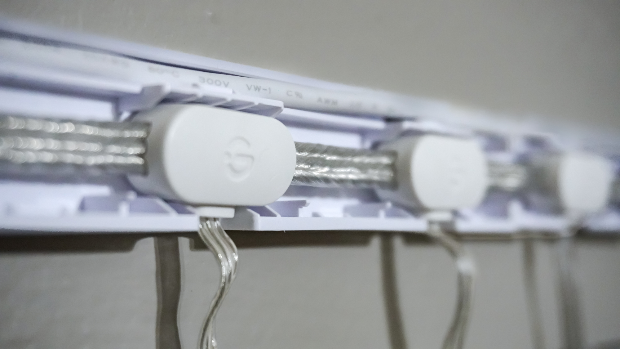 A close-up shot showing the Govee Curtain Lights Pro installed in the included mounting bar