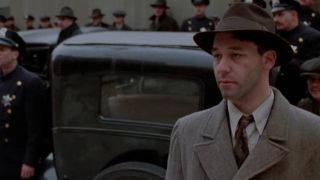 Sam Raimi in a suit and hat in Miller's Crossing