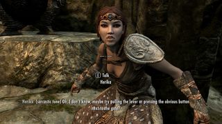 Skyrim character standing in a dungeon in front of a gate
