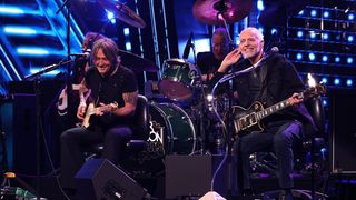 Keith Urban and Peter Frampton perform onstage during the 2024 Rock &amp; Roll Hall Of Fame Induction Ceremony streaming on Disney+ at Rocket Mortgage Fieldhouse on October 19, 2024 in Cleveland, Ohio