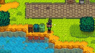 Stardew Valley mods - Automate - A player stands with a lobster beside a recycling machine, chest, worm bin, and three crab pots that will automatically catch river crabs.