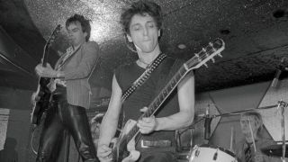 A photograph of Walter Lure on stage with the Heartbreakers