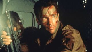 Arnold Schwarzenegger as Dutch holding a gun in &quot;Predator&quot;