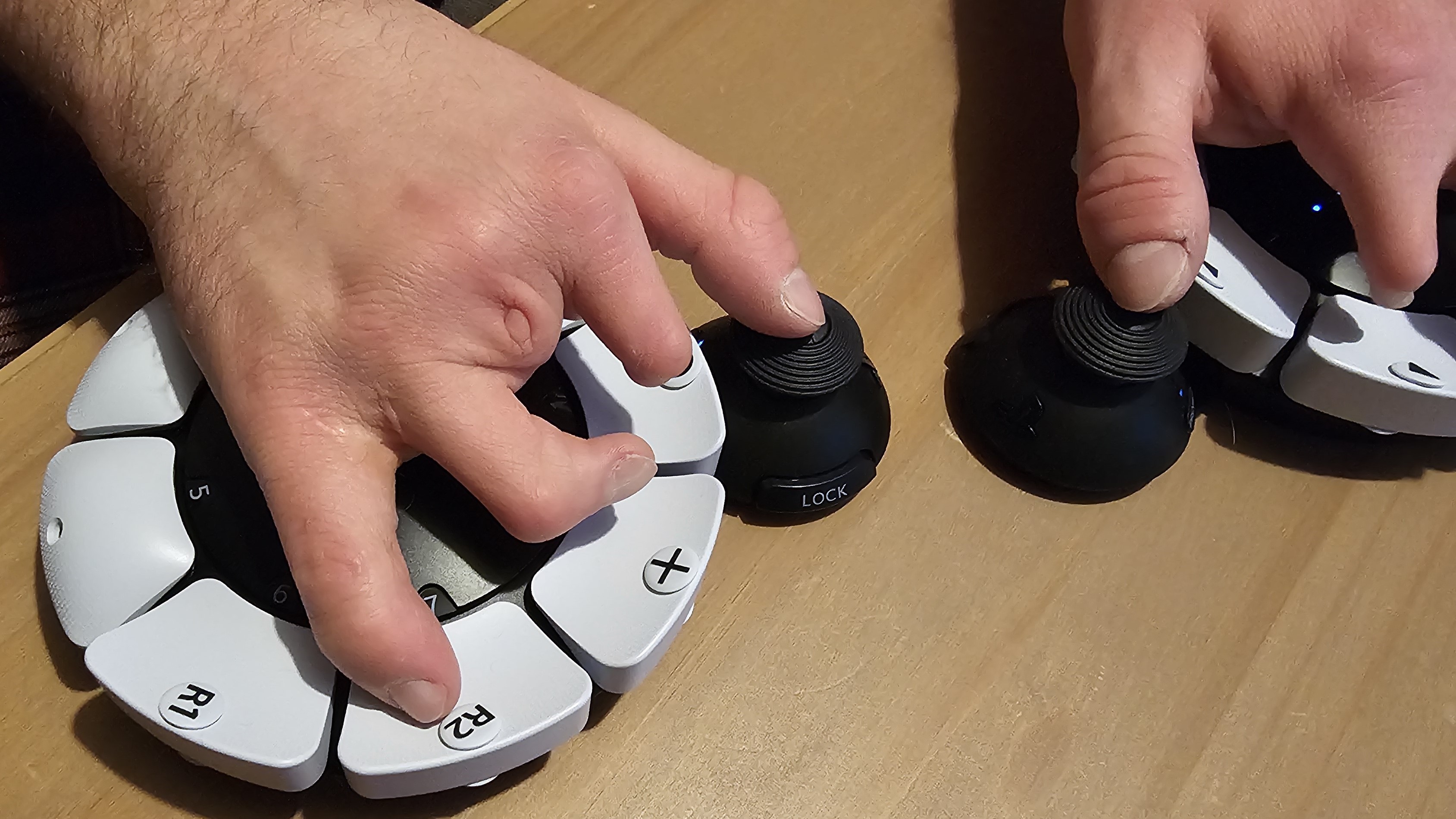 The PlayStation Access controller being used by someone with accessibility needs.