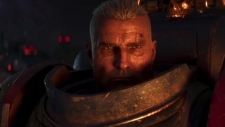 A screenshot of a marine without an helmet in the Total War: Warhammer 40K trailer
