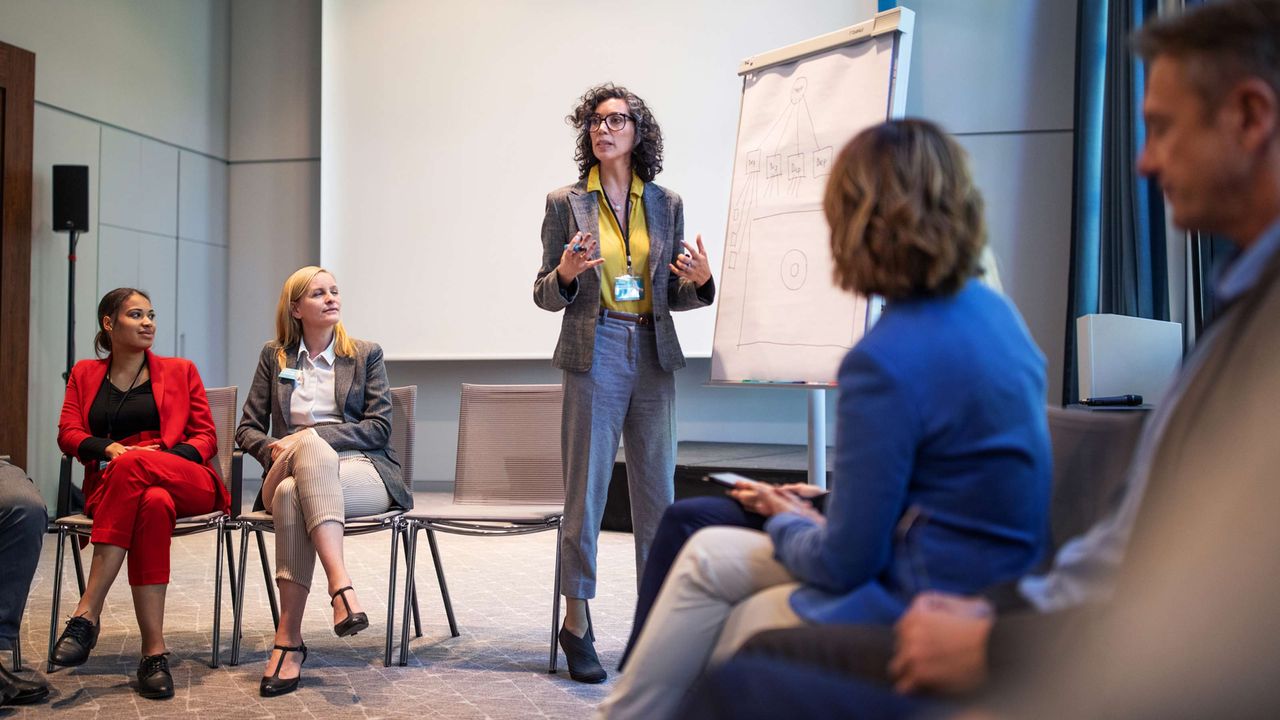 A woman leads a workshop.