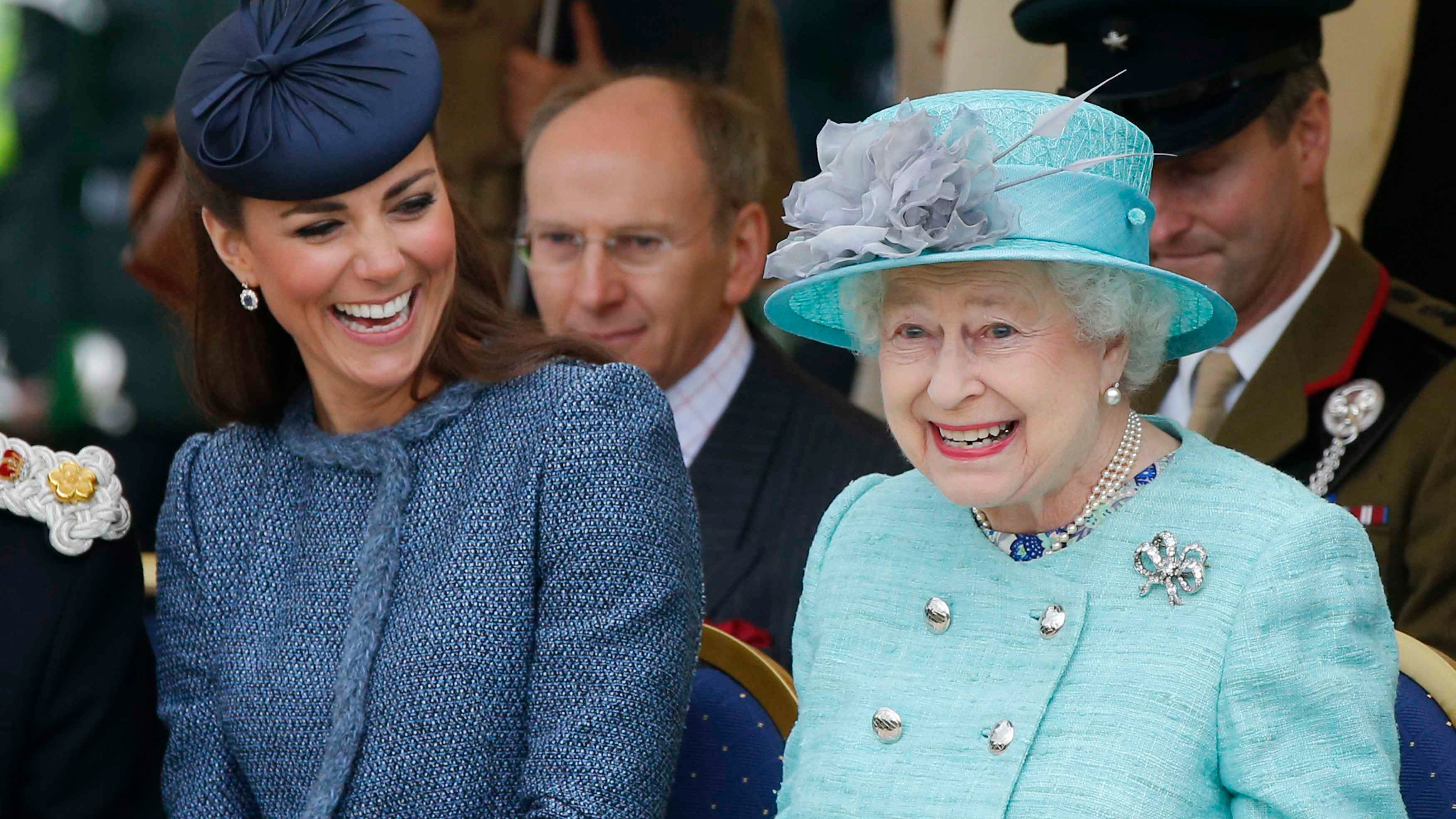 Catherine, Princess of Wales and Queen Elizabeth II watch part of a children's sports event while visiting Vernon Park