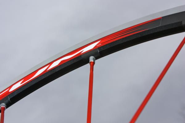 The machined rim walls lower the rotating weight while keeping strength high around the proprietary alloy nipples.