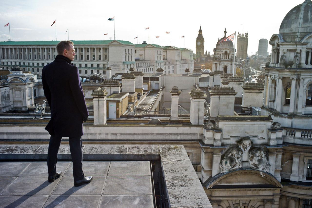 Daniel Craig as James Bond peers across to the old War Office in Skyfall (2012). Picture by Francois Duhamel/©Columbia Pictures/courtesy Everett Collection