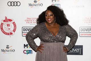 Judi Love on the red carpet in 2019 wearing a sparkly dress