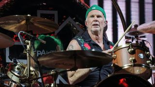 Chad Smith performing live on DW drum kit with Paiste cymbals