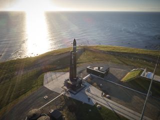 A Rocket Lab Electron rocket sits on the launchpad at the company's launch facility in New Zealand, ahead of a test flight. The launch window opens Dec. 8, 2017.