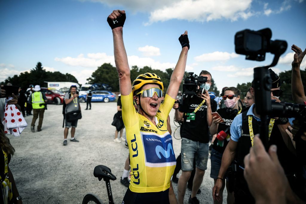 Annemiek Van Vleuten wearing the overall leader&#039;s yellow jersey celebrates after winning stage 8 and the overall title at the Tour de France Femmes