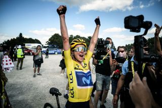 Annemiek Van Vleuten wearing the overall leader's yellow jersey celebrates after winning stage 8 and the overall title at the Tour de France Femmes