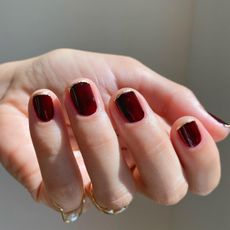 Burgundy and gold nail art