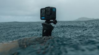 GoPro Hero 12 Black Action Camera held in hand in water