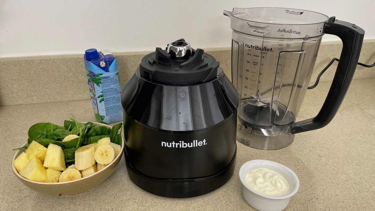 Smoothie ingredients next to blender