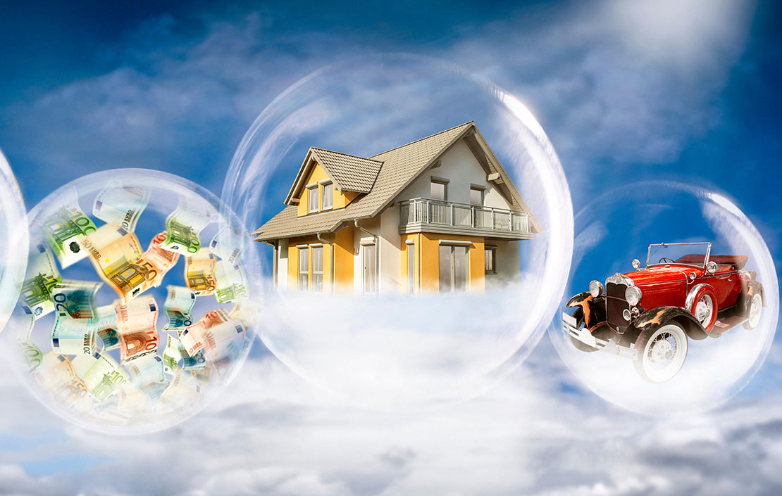 Soap bubbles with beach scene, banknotes, house and car