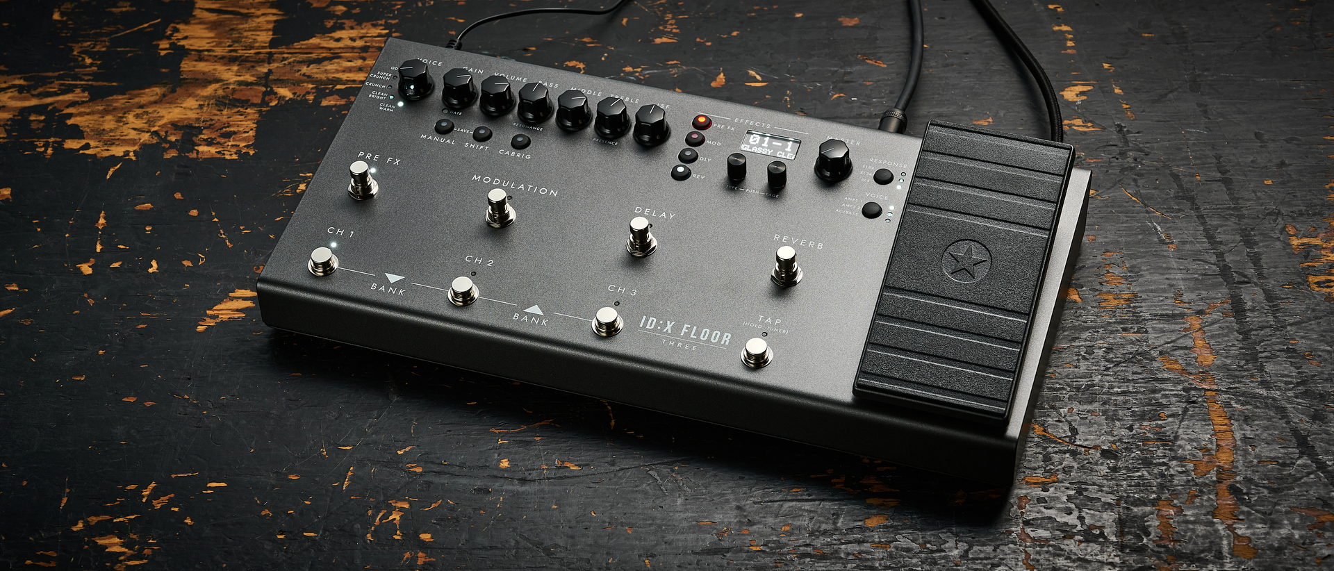 A Blackstar ID:X Floor Three multi-effects pedal on a worn, wooden floor