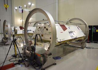 The twin satellites for NASA's GRACE-FO mission are prepared for launch at the Astrotech Space Operations processing facility at Vandenberg Air Force Base, California.