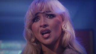 Sabrina Carpenter wears Prada lip balm in the music video “Please Please Please”