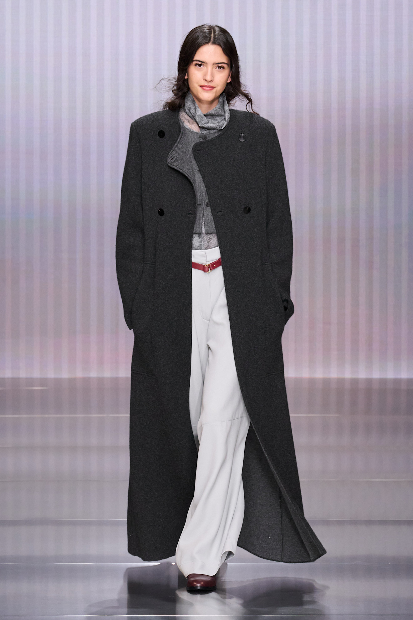 a model walks the giorgio armani show during milan fashion week.