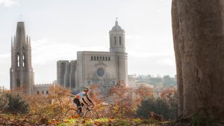 Bike rider in front of cathedral in Girona