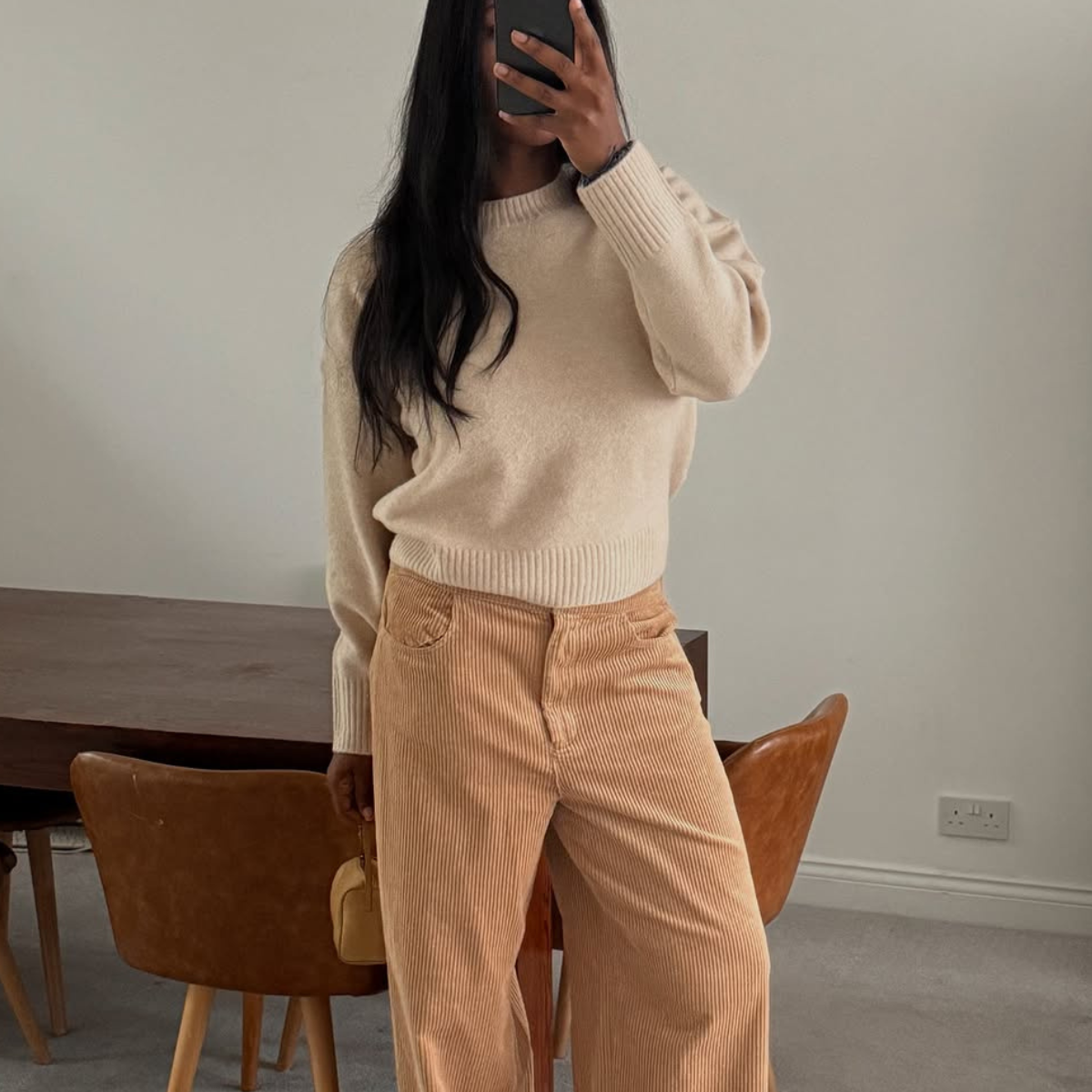 woman wearing winter to spring transitional pant trend 2026